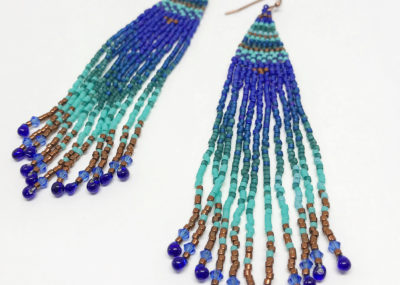 Beach Ombre Woven Fringe earrings on white background.