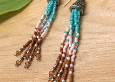 Southwestern Fringe Ombre Tassel earrings on wood background.