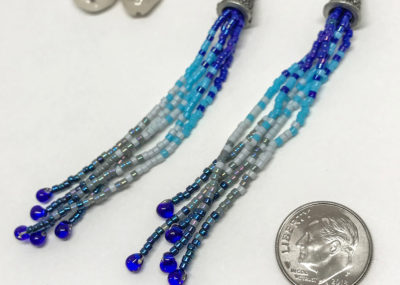 Wave of Blue Fringe Ombre Tassel earrings sizing with dime.