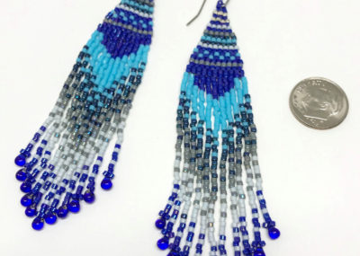 Wave of Blue Fringe Ombre Woven earrings sizing with dime.