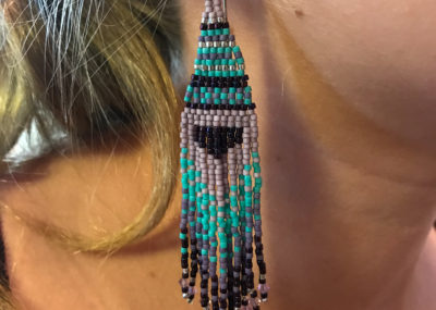 Woven Fringe ombre earring on model